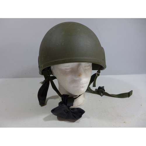 306 - A GREEN NATO HELMET AND LINER DATED 1996