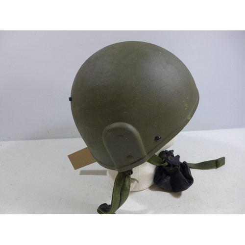 306 - A GREEN NATO HELMET AND LINER DATED 1996