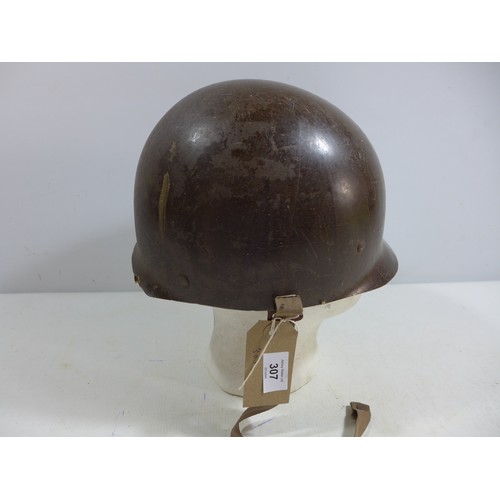 307 - A MILITARY HELMET AND LINER