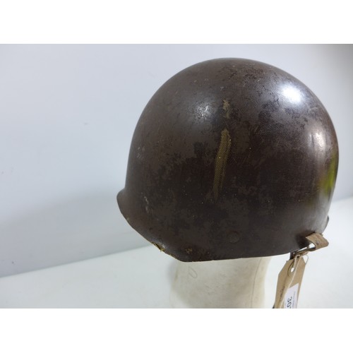 307 - A MILITARY HELMET AND LINER