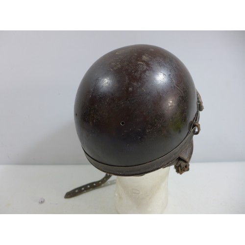 309 - A MILITARY TANKERS HELMET AND LINER, THE INSIDE MARKED PRODUCTION STAR HOLLYWOOD DEPOSE FRANCE