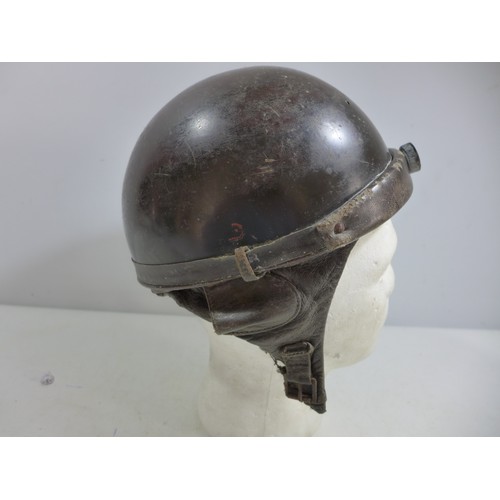 309 - A MILITARY TANKERS HELMET AND LINER, THE INSIDE MARKED PRODUCTION STAR HOLLYWOOD DEPOSE FRANCE