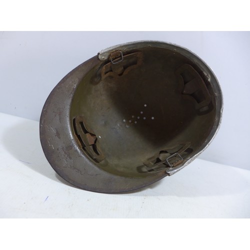 310 - A WORLD WAR II NAZI GERMANY GREEN PAINTED METAL LUFTSCHUTZ HELMET