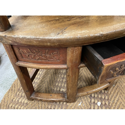 101A - A VINTAGE CHINESE CARVED HARDWOOD CHILD'S ARMCHAIR WITH LOWER DRAWER TO SEAT, HEIGHT 80CM, WIDTH 53C... 