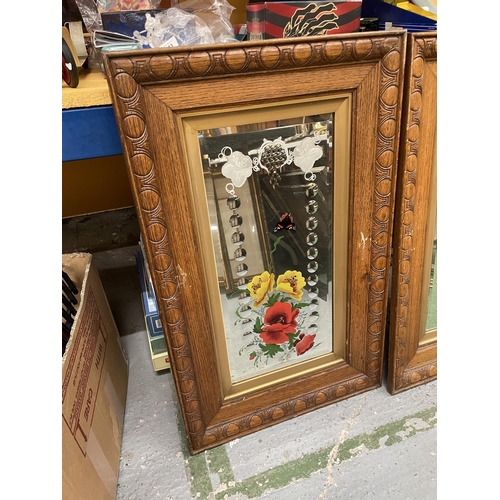 300 - A PAIR OF OAK FRAMED MIRRORS WITH PAINTED FLORAL AND ETCHED DESIGN