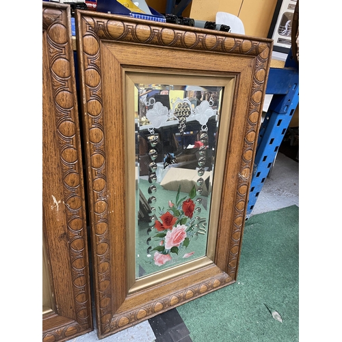 300 - A PAIR OF OAK FRAMED MIRRORS WITH PAINTED FLORAL AND ETCHED DESIGN