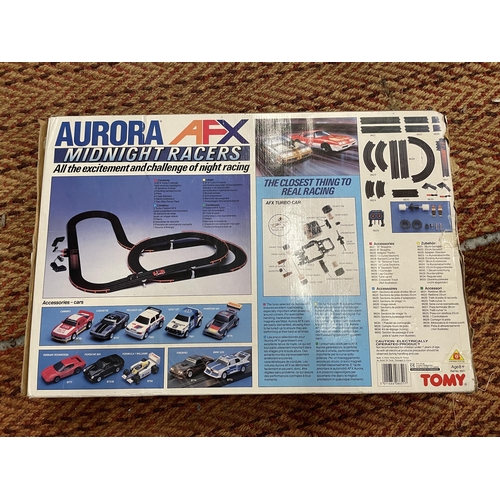 400 - A BOXED TOMY AFX MIDNIGHT RACERS SLOT RACING SET, WITH BOTH CARS