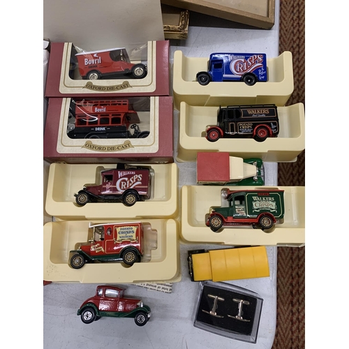 379 - TEN DIECAST VANS, VARIOUS MODELS ACCESSORIES - A CLOCK, CUFF LINKS ETC