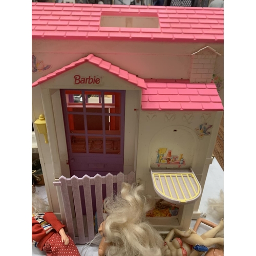 391 - A BARBIE HOUSE AND DOLLS