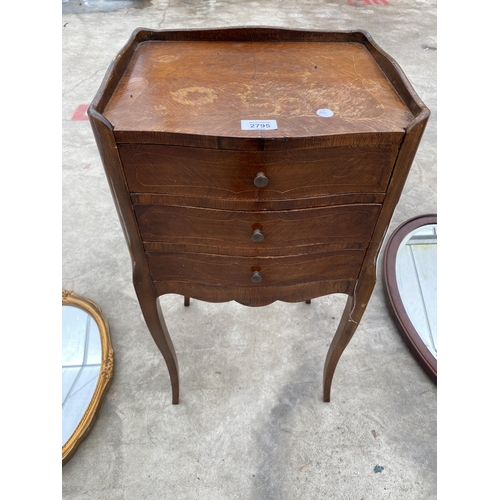 2795 - A CONTINENTAL MARQUETRY CROSSBANDED BEDSIDE TABLE ENCLOSING THREE DRAWERS