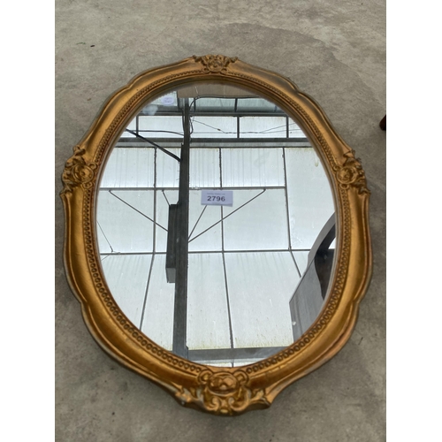 2796 - AN OVAL MODERN GILT FRAMED WALL MIRROR BY GALLERY FRAMING, 20X14