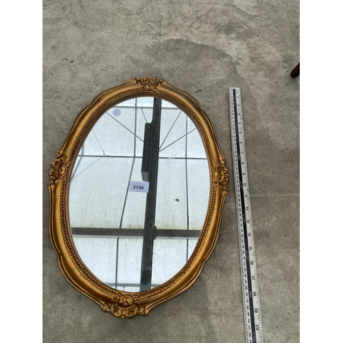 2796 - AN OVAL MODERN GILT FRAMED WALL MIRROR BY GALLERY FRAMING, 20X14