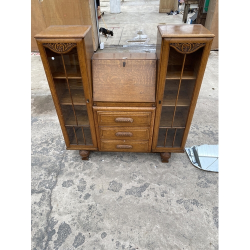 2799 - AN EARLY 20TH CENTURY OAK SIDE BY SIDE BUREAU ENCLOSING THREE DRAWERS