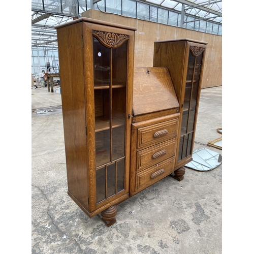 2799 - AN EARLY 20TH CENTURY OAK SIDE BY SIDE BUREAU ENCLOSING THREE DRAWERS