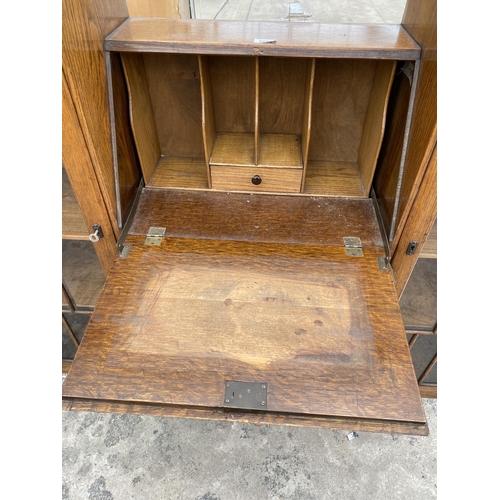 2799 - AN EARLY 20TH CENTURY OAK SIDE BY SIDE BUREAU ENCLOSING THREE DRAWERS