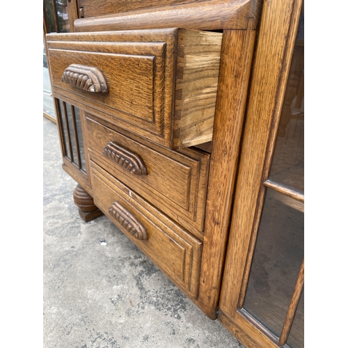 2799 - AN EARLY 20TH CENTURY OAK SIDE BY SIDE BUREAU ENCLOSING THREE DRAWERS