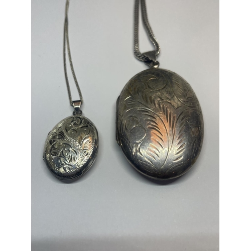 553 - TWO SILVER LOCKETS ON CHAINS