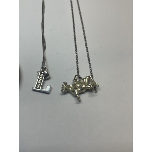 554 - FOUR SILVER NECKLACES WITH PENDANTS