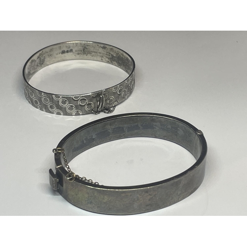 556 - TWO SILVER BANGLES