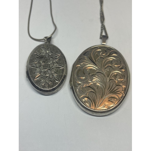 565 - TWO SILVER LOCKETS ON CHAINS