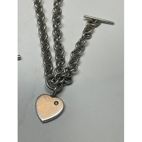 570 - TWO SILVER T BAR NECKLACES WITH HEART CHARMS