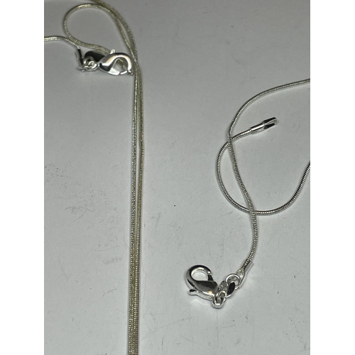 577 - TWO SILVER LOCKETS WITH CHAINS