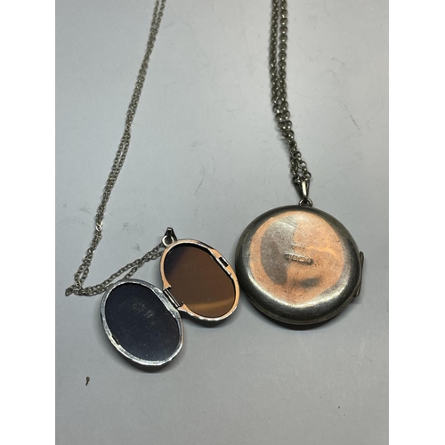 584 - TWO SILVER LOCKETS WITH CHAINS