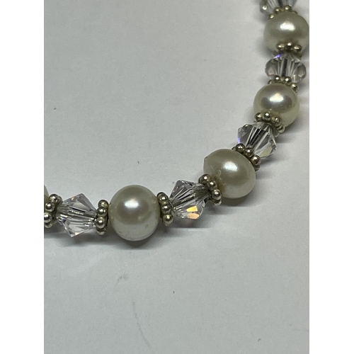 594 - A DECORATIVE SILVER NECKLACE AND SILVER/PEARL/CRYSTAL BRACELET