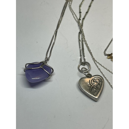 610 - FOUR SILVER NECKLACES WITH PENDANTS