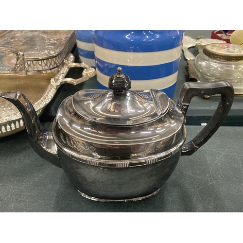 176 - A VINTAGE FOUR PIECE SILVER PLATED TEA SET