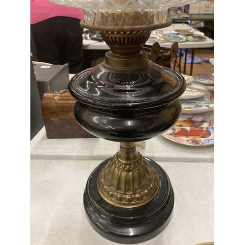 184 - A VINTAGE BRASS AND GLASS OIL LAMP ON MARBLE BASE