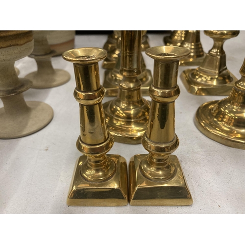 186 - A COLLECTION OF TEN ASSORTED VINTAGE BRASS CANDLESTICKS