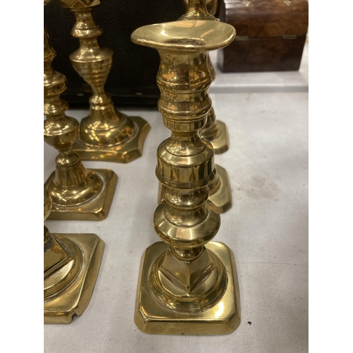 186 - A COLLECTION OF TEN ASSORTED VINTAGE BRASS CANDLESTICKS