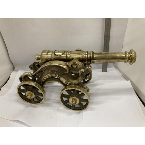 11 - A VINTAGE BRASS MODEL OF A CANNON