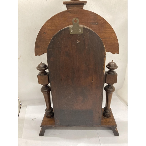 15 - A VINTAGE OAK CHIMING MANTLE CLOCK WITH COLUMN SUPPORTS HAVING LION HEAD DESIGN, WITH PENDULUM, HEIG... 
