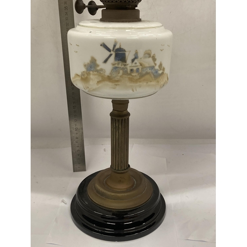 33 - A VINTAGE OIL LAMP WITH BRASS CORINTHIAN COLUMN SUPPORT AND PAINTED WINDMILL SCENE RESEVOIR