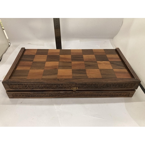 46 - A VINTAGE HARDWOOD CHESS BOARD WITH CARVED WOODEN PIECES