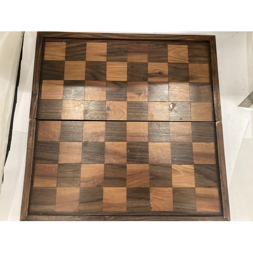 46 - A VINTAGE HARDWOOD CHESS BOARD WITH CARVED WOODEN PIECES