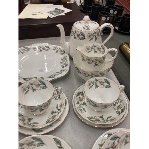 235 - A FLORAL BONE CHINA TEASET