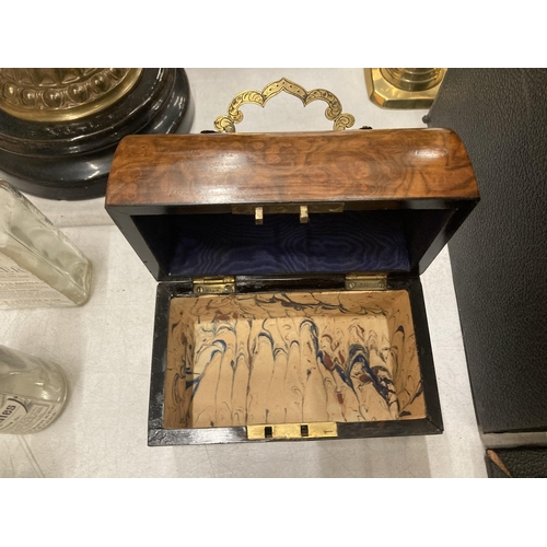 250 - A VINTAGE WALNUT DOMED JEWELLERY BOX WITH BRASS HANDLE