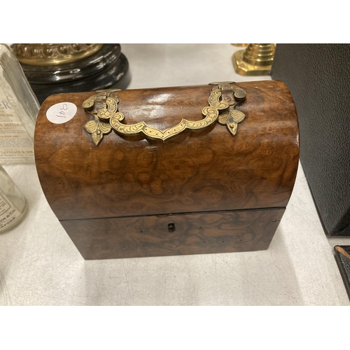 250 - A VINTAGE WALNUT DOMED JEWELLERY BOX WITH BRASS HANDLE