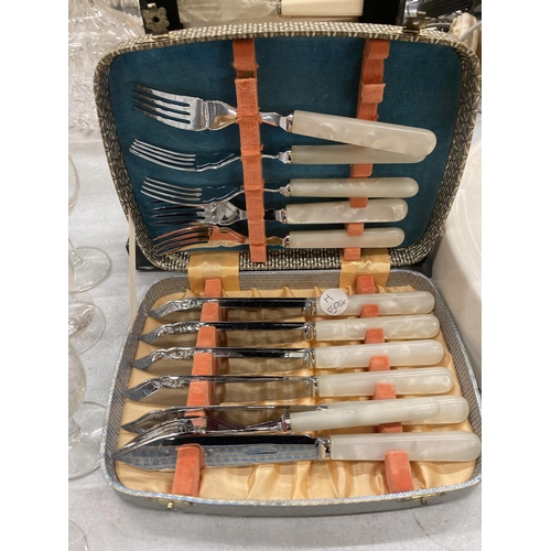 277 - A GROUP OF THREE CASED SILVER PLATED FLATWARE SETS