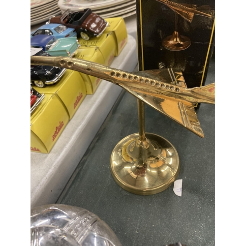 292 - A BOXED BRASS MODEL OF A CONCORDE AEROPLANE