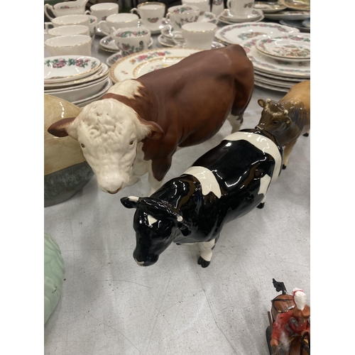 297 - A GROUP OF CATTLE MODELS - BESWICK COWS, RAM ETC