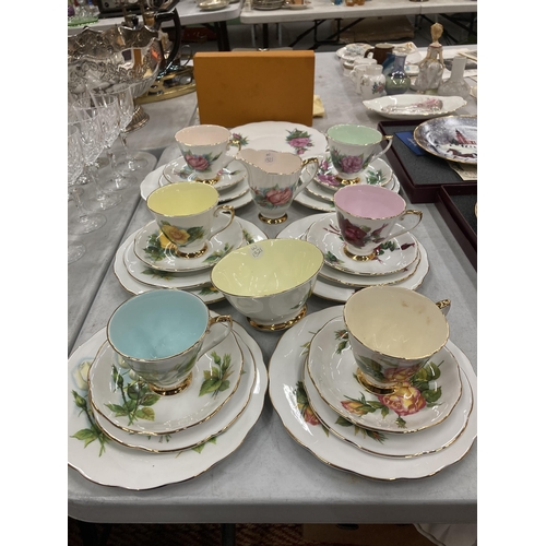 300 - A COLLECTION OF FLORAL DESIGN BONE CHINA TRIOS