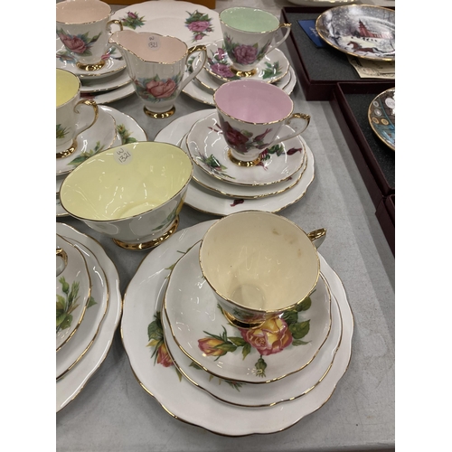 300 - A COLLECTION OF FLORAL DESIGN BONE CHINA TRIOS