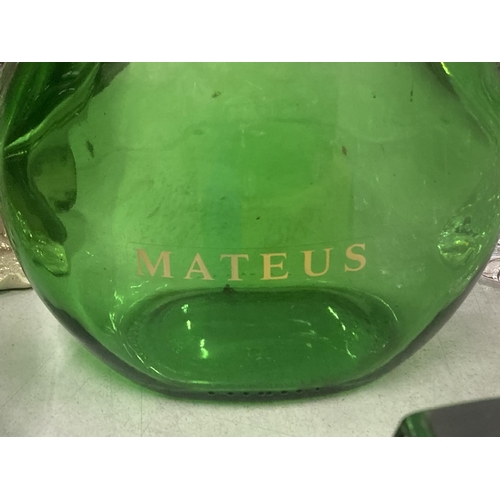 803 - A VINTAGE GREEN GLASS MATEUS WINE DECANTER