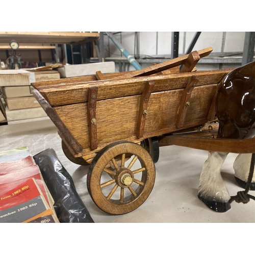 1004 - A CERAMIC SHIRE HORSE WITH WOODEN CART