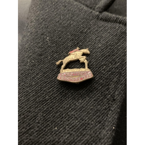 922 - A HUNTING JACKET WITH BRITISH EQUESTRIAN TEAM ENAMEL BADGE