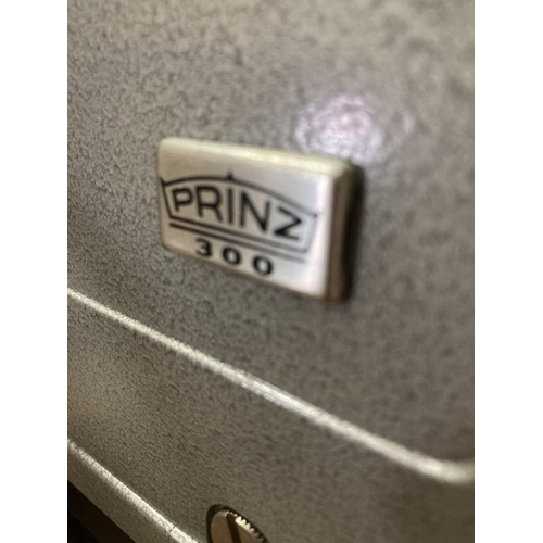 928 - A VINTAGE PRINZ 300 PROJECTOR AND CASE